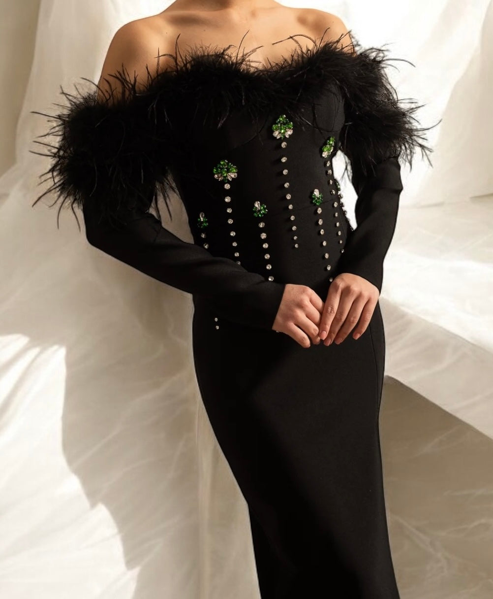 Off shoulder black bandage dress with feathers and crystals