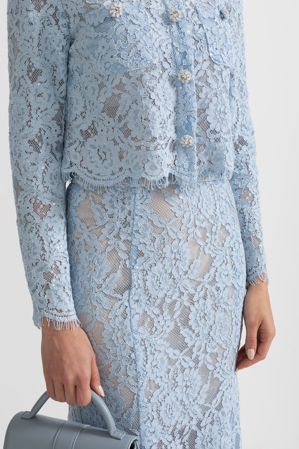 Blue lace co-ord set with sparkling neckline embellishments and midi skirt