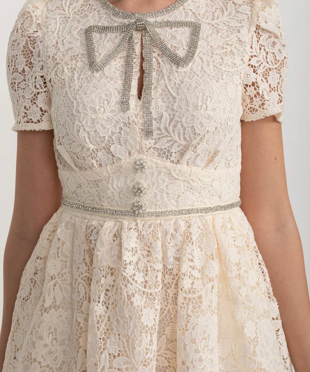 Ivoire Short Sleeved Lace Dress With Rounded Neckline And Decorative Bow