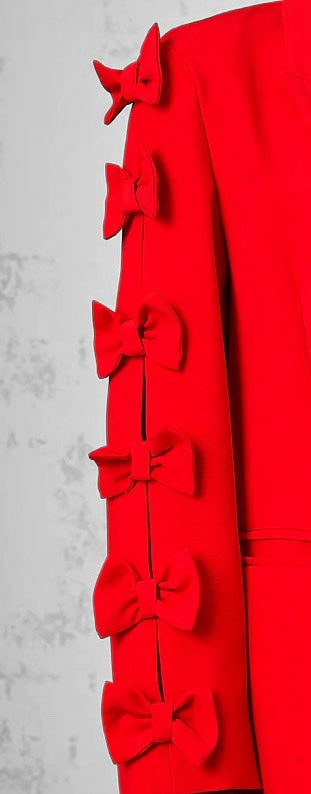 Elegant red blazer with bow details on sleeves